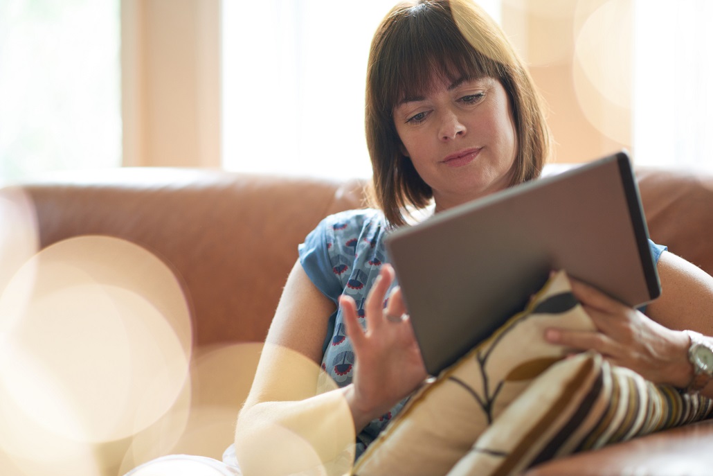 Woman using tablet to get financial aid tips