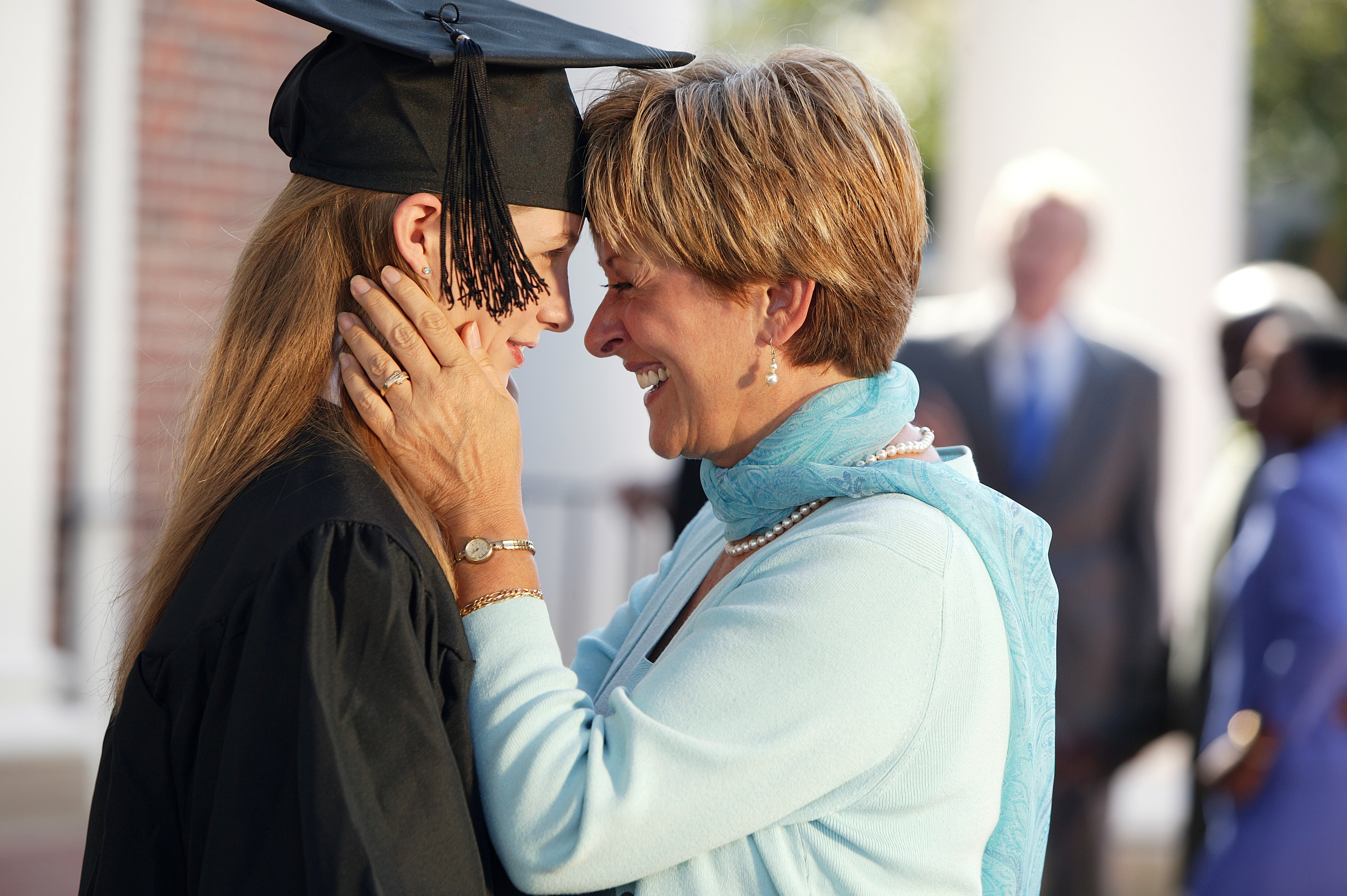 Student and parent celebrating graduation