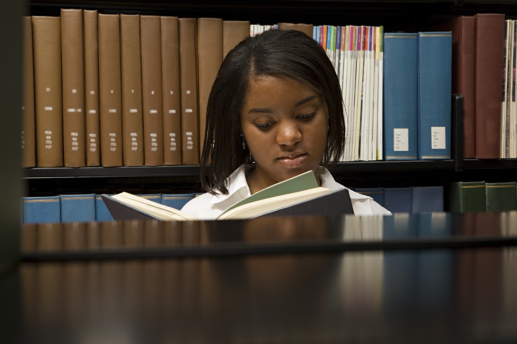 Gift in the library reading about private scholarships