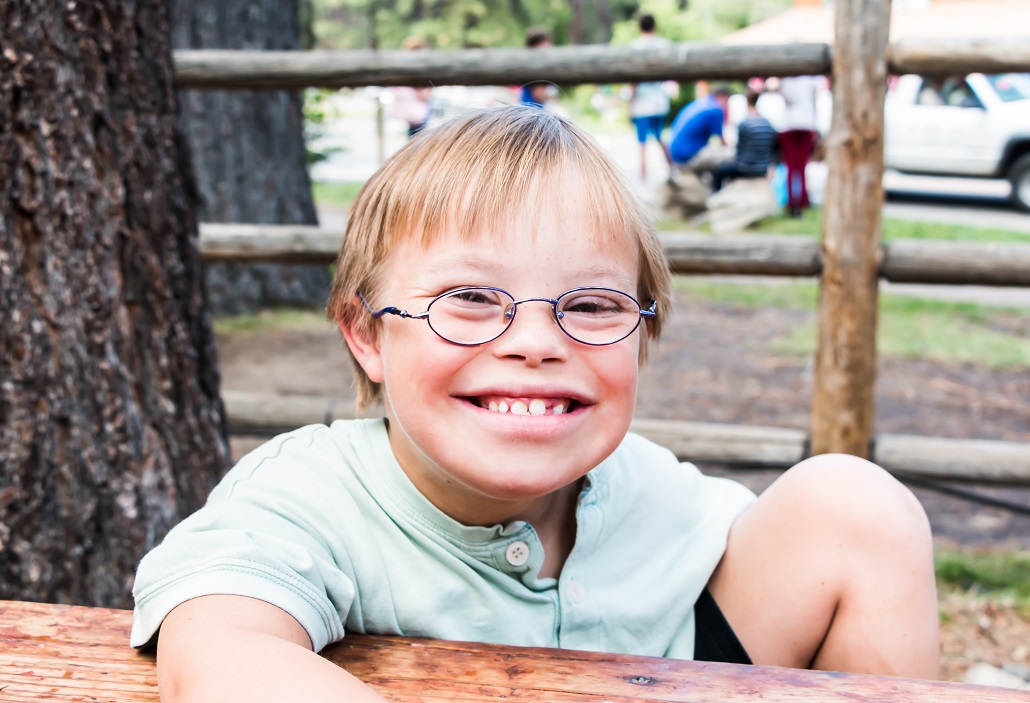 Child sitting at picnic table