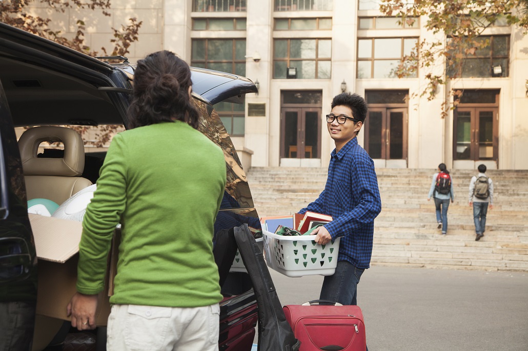 Parents moving child into college dorm