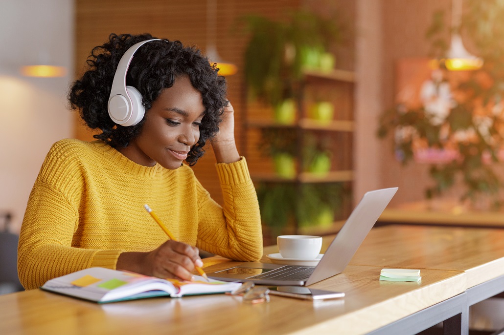 Student using computer to research scholarships with deadlines in September