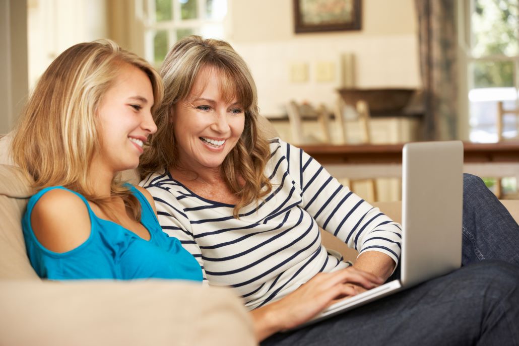 Mom and teenage daughter college planning during junior year