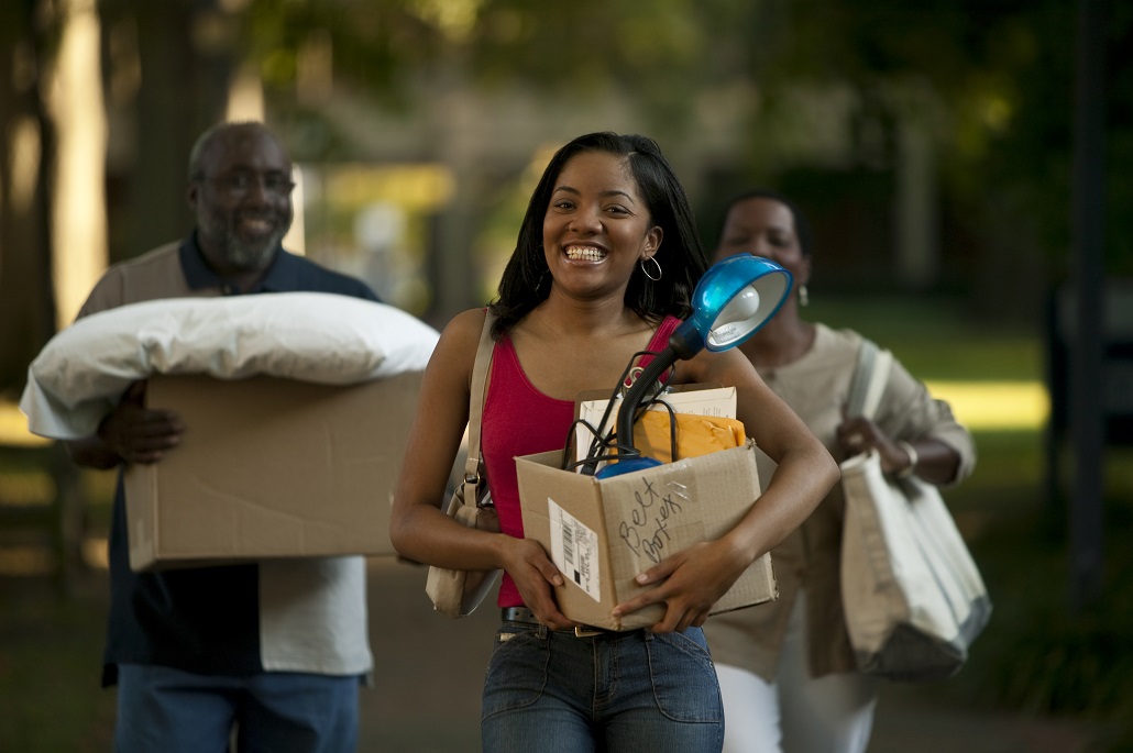 Student heading to campus after reviewing college packing list