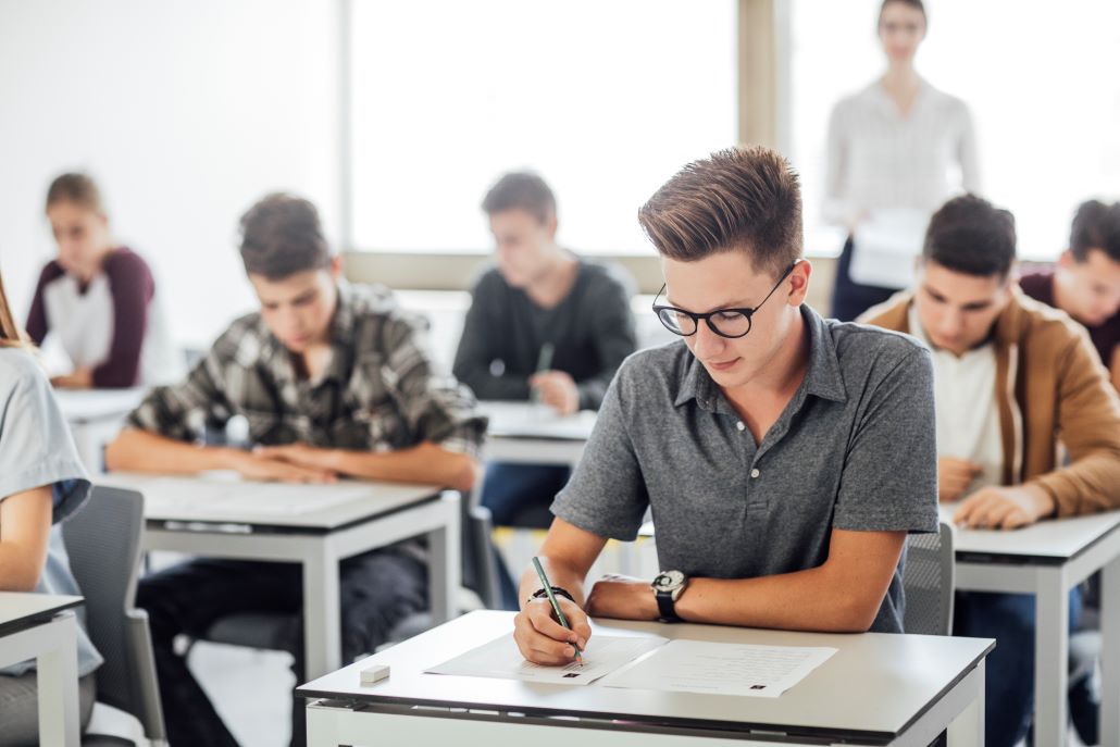 Students in a classroom taking the ACT