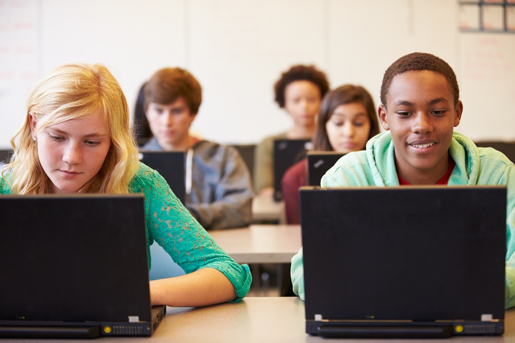 Students in class using laptops