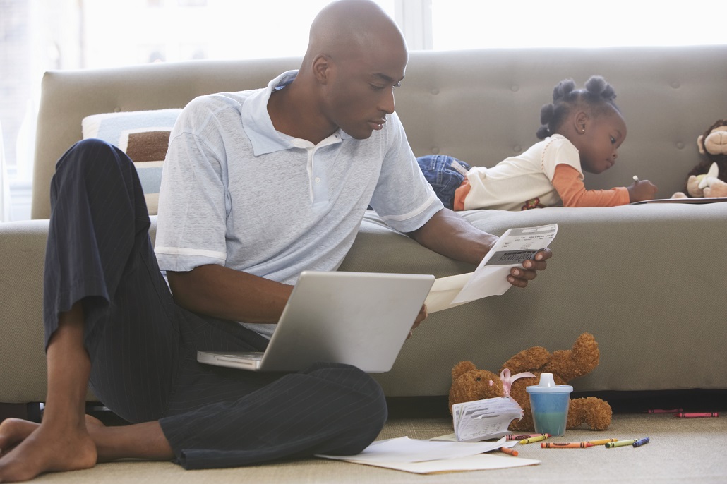 Father reviewing paperwork with daughter 