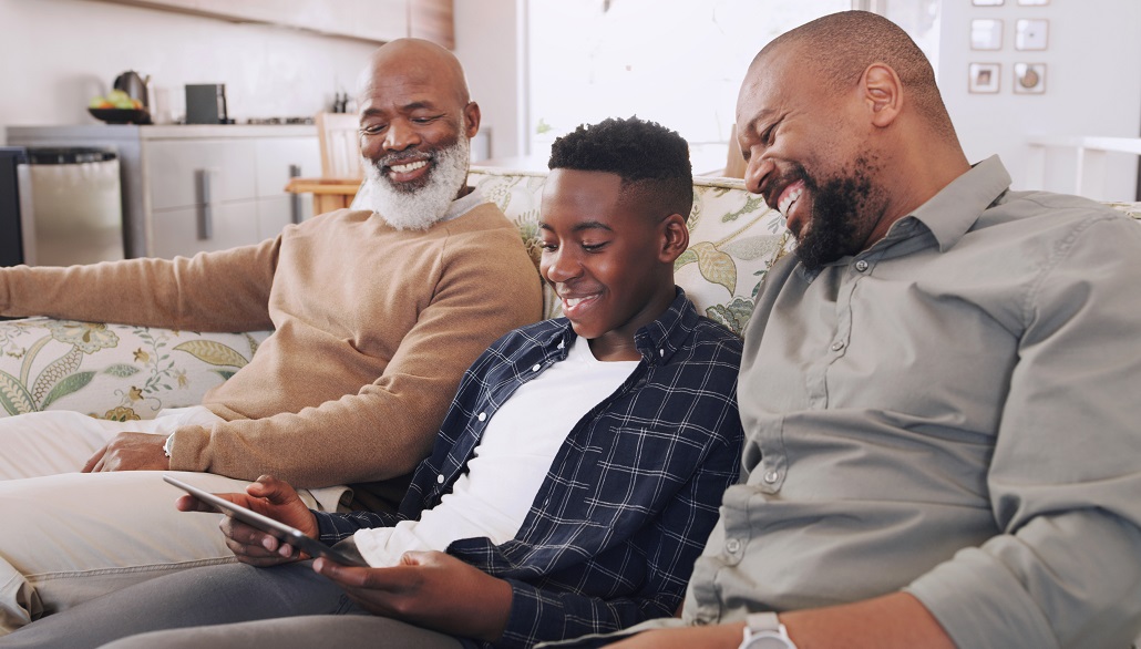 Parents and son using tablet to learn how colleges determine financial aid