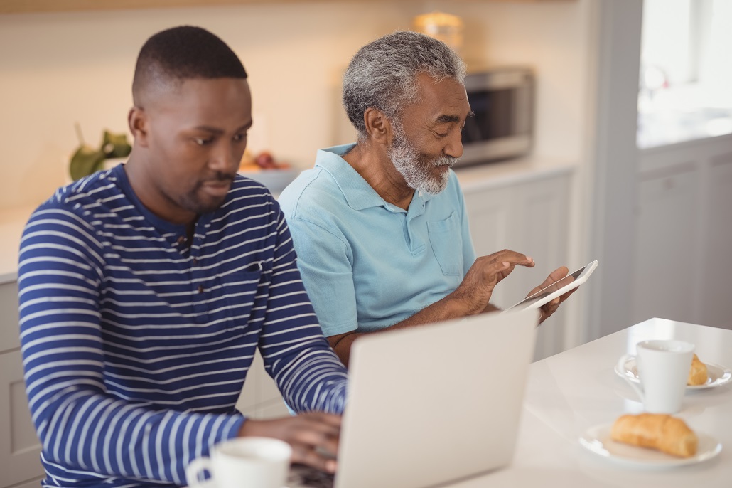 A student and parent researching colleges