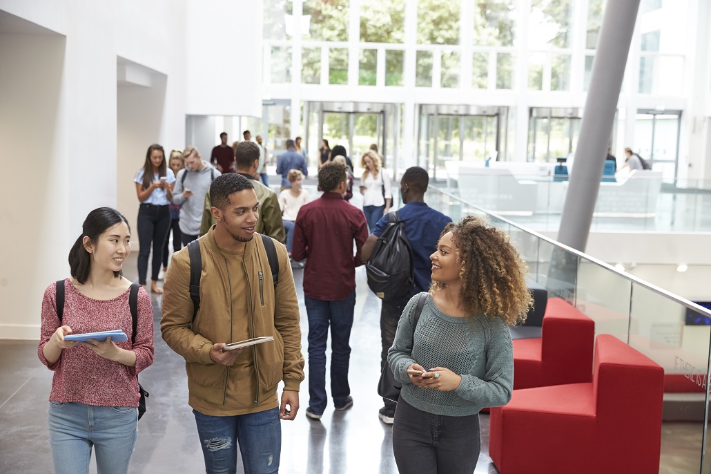 Students walking in college building 