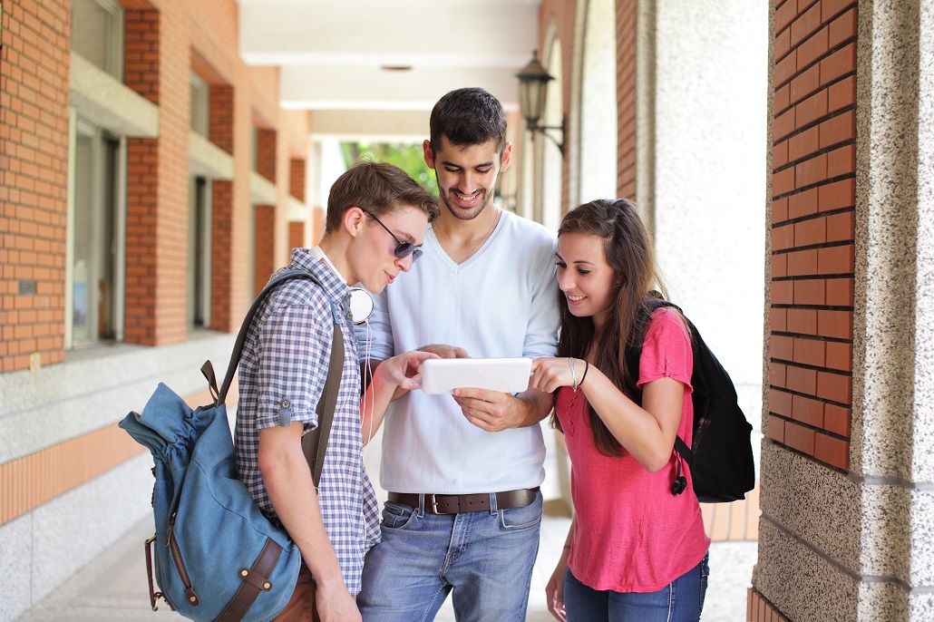 Students looking at a tablet