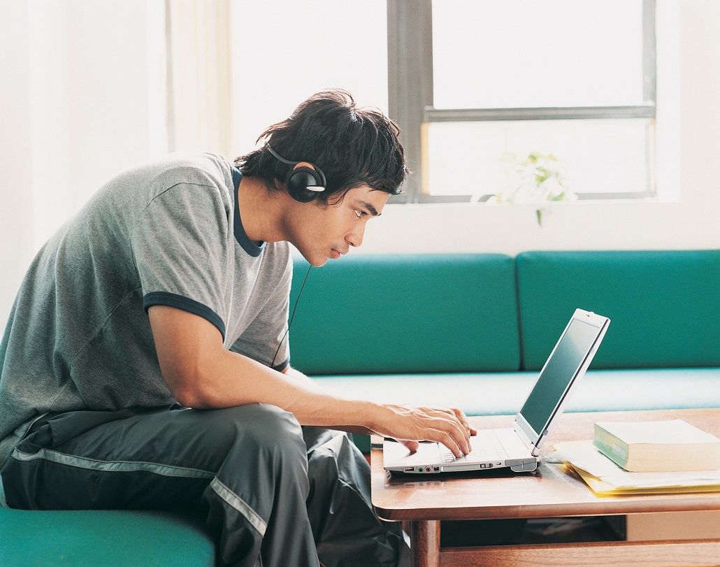 Student using laptop to learn how to add schools to the FAFSA