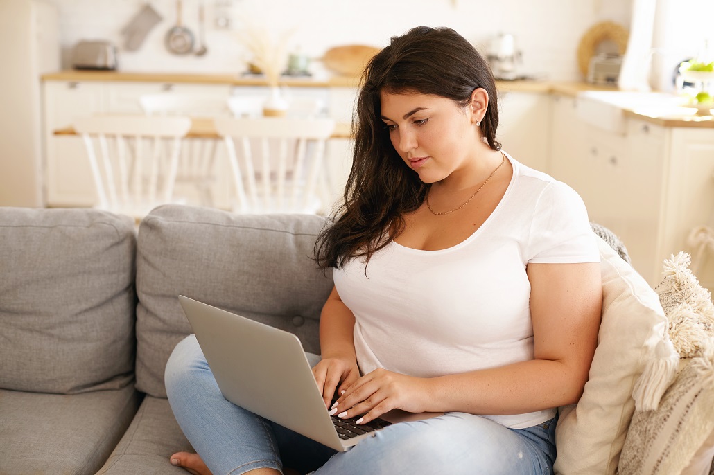 Woman using computer to learn about MEFA REFI loans