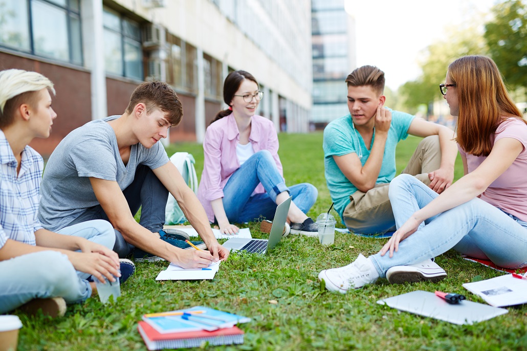 Student studying on campus quad