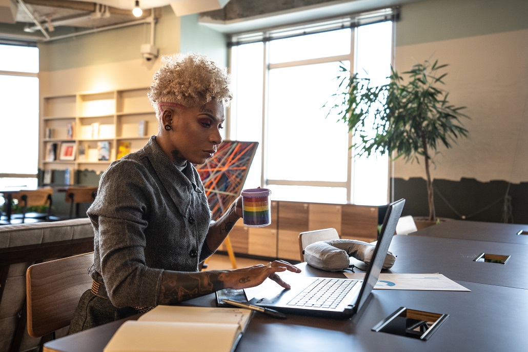 Woman using laptop after going back to college