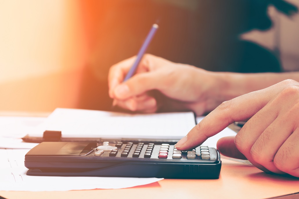 Woman using calculator