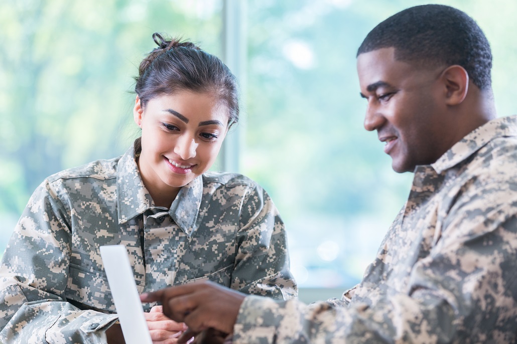 Veterans using laptop tp learn about education benefits 