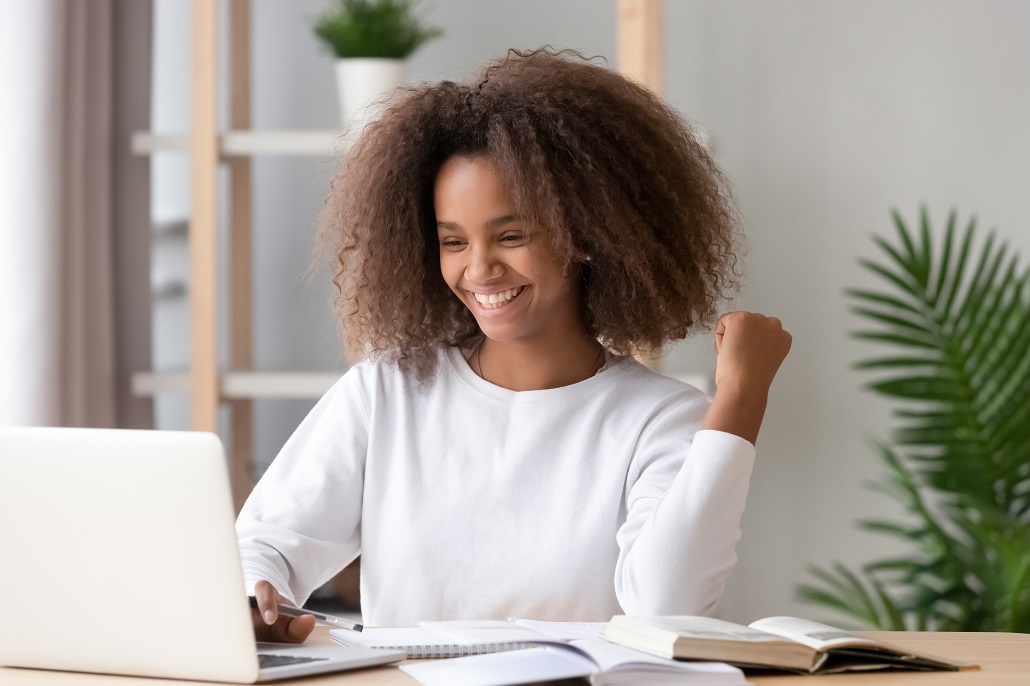 Student using laptop to learn college planning tips