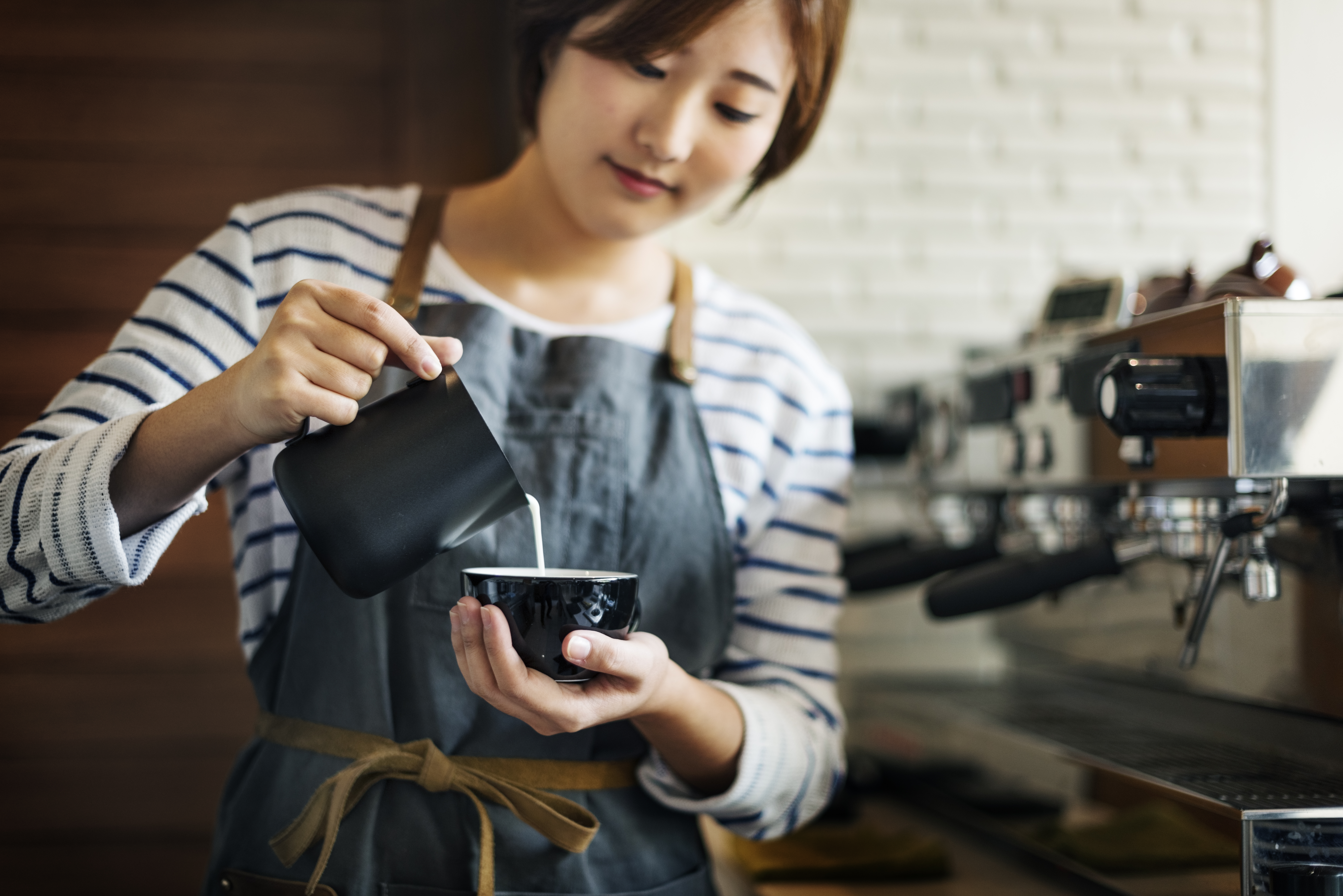 A student working at a coffee shop