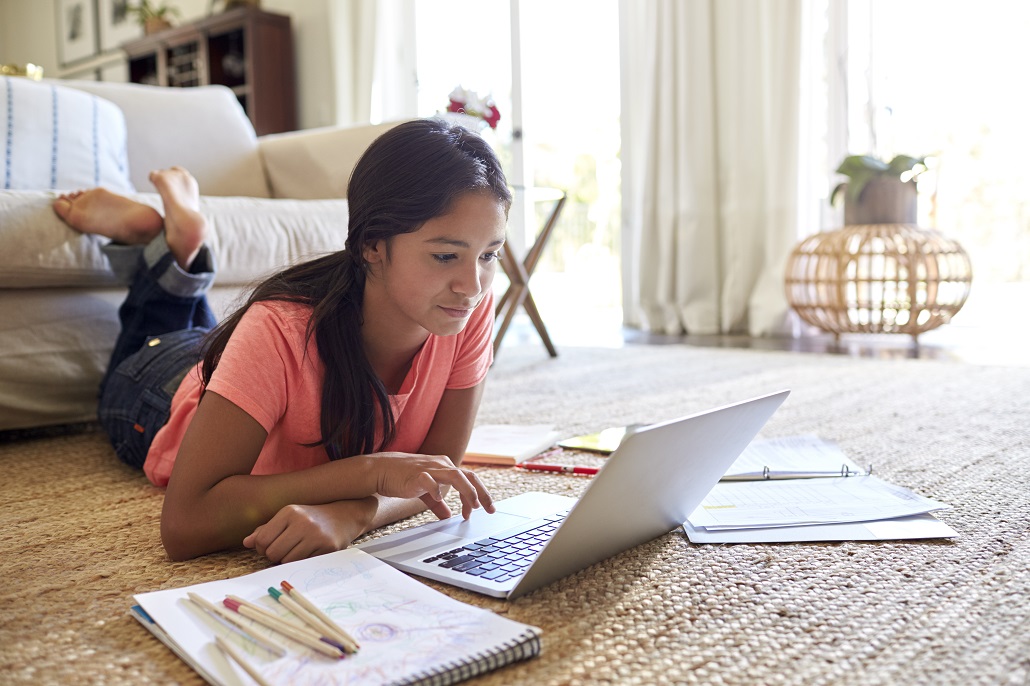 Student using laptop in off campus housing 