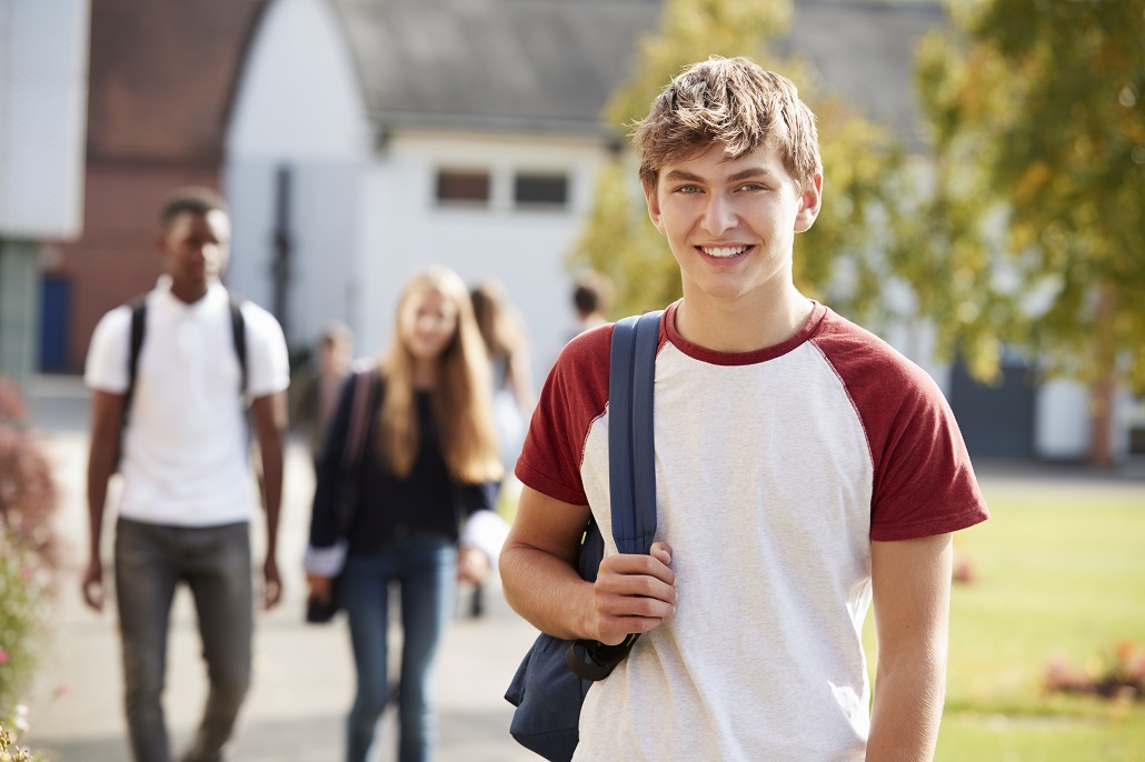 Boy with backpack outside 