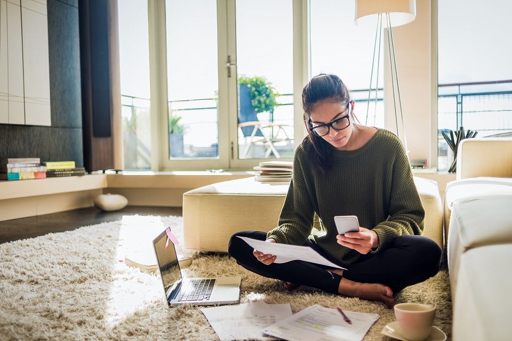 Woman fitting student loan payments into financial plans