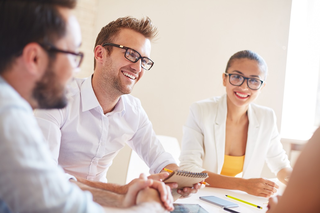 Administrators in a financial aid office discussing giving students more money