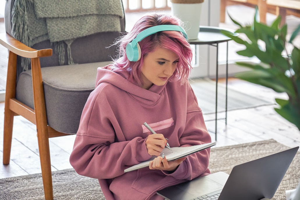 Student using computer to learn how to make college affordable
