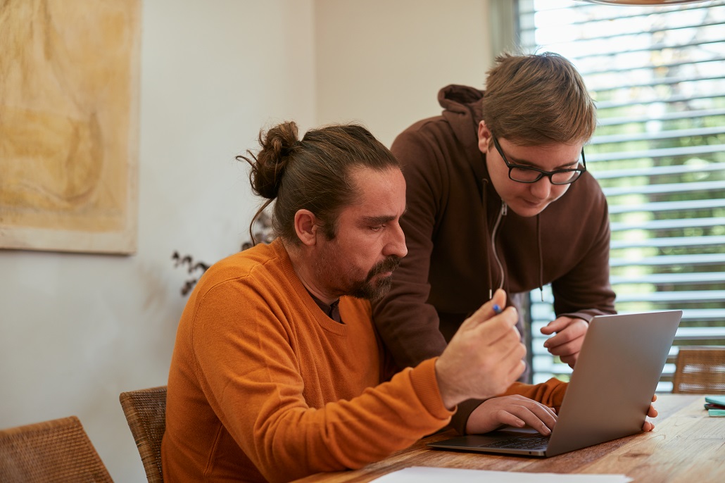 Father and son discussing college costs 