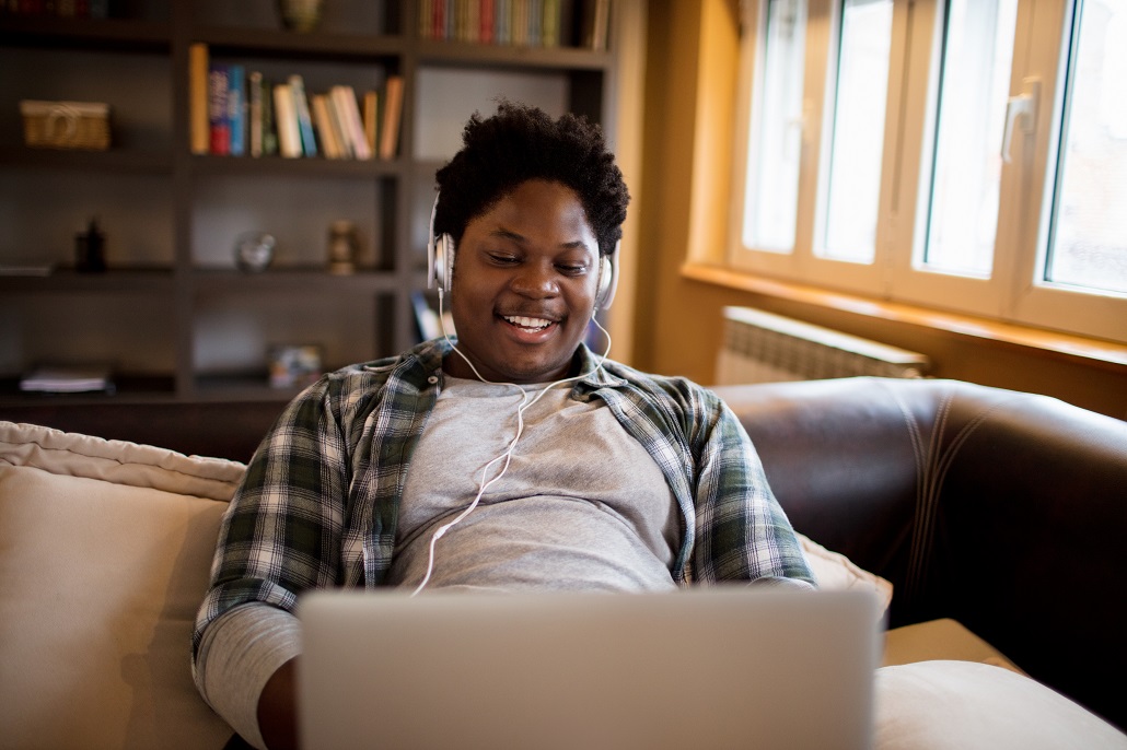 Man using laptop to learn about loan agreements