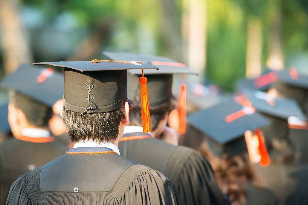 Students in a Line Outside Graduating on Time