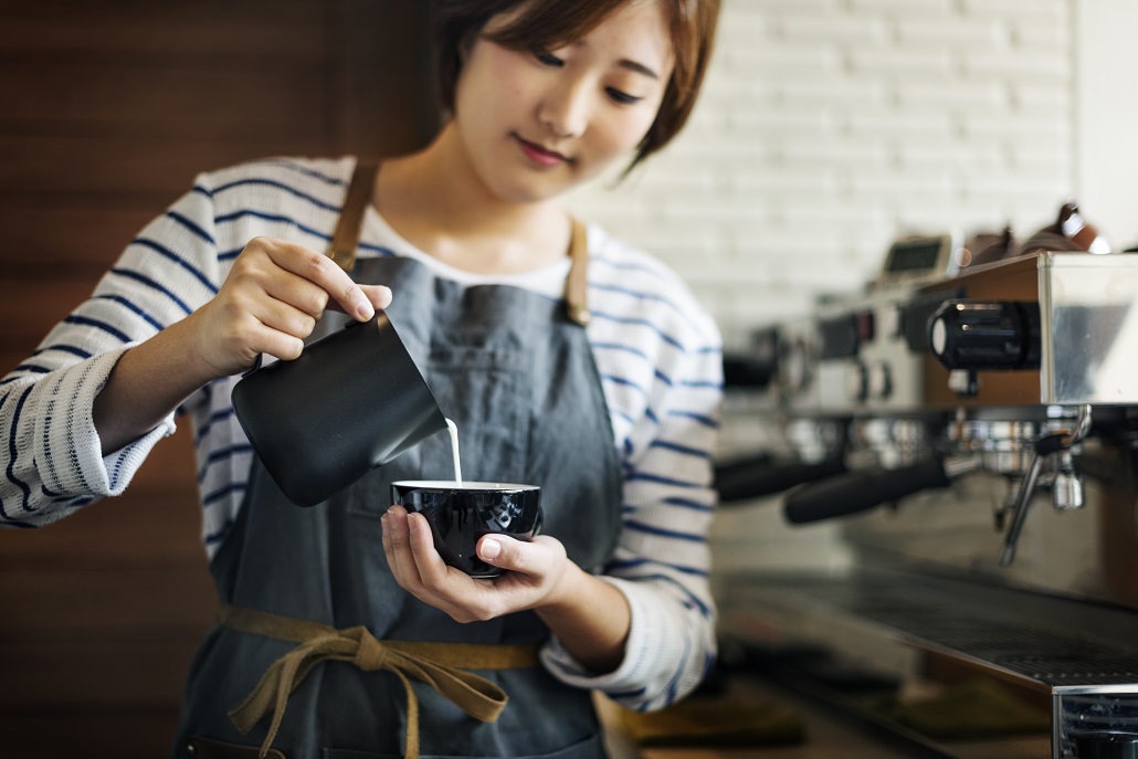 A student working at a coffee shop