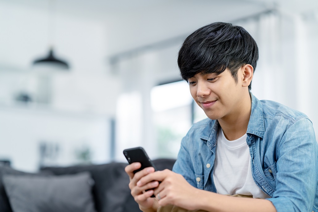 Junior using phone to plan for college