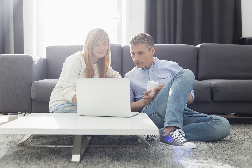 Father and daughter using computer