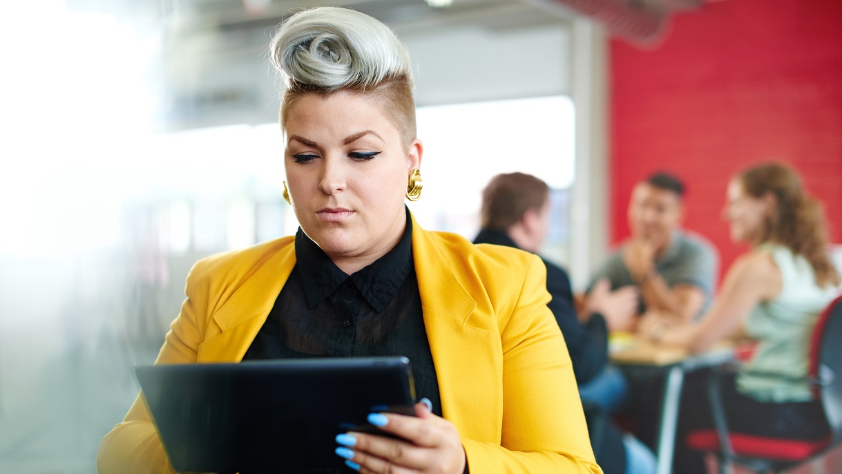 Woman using tablet to learn about NPEA