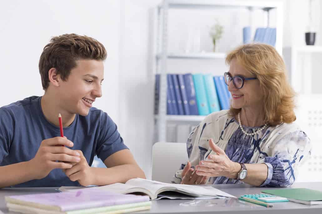 woman and son working at table