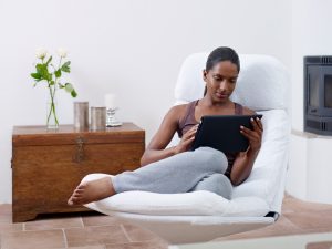 woman looking at tablet