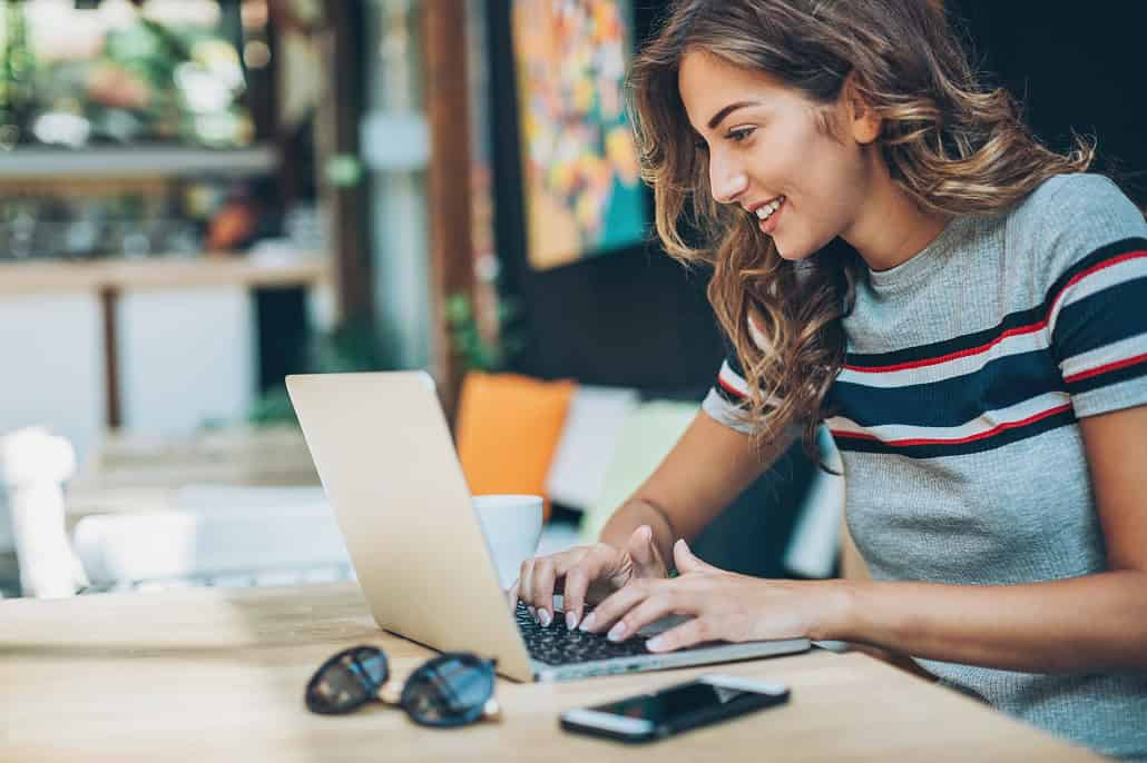 Student using laptop to work on college admissions