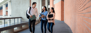 3 students walking and talking