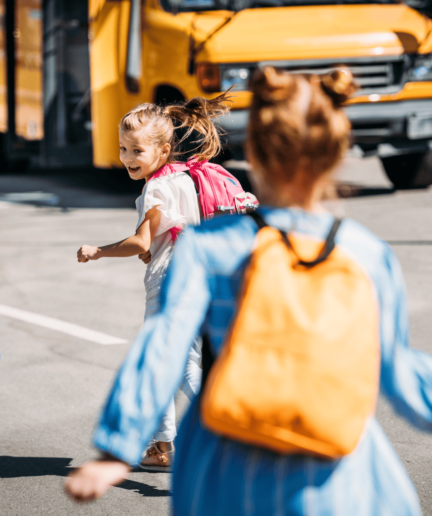 2 kids going to the bus