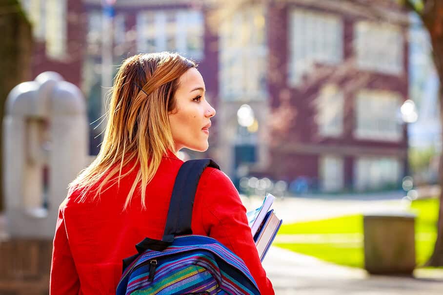 A young female college student between classes.