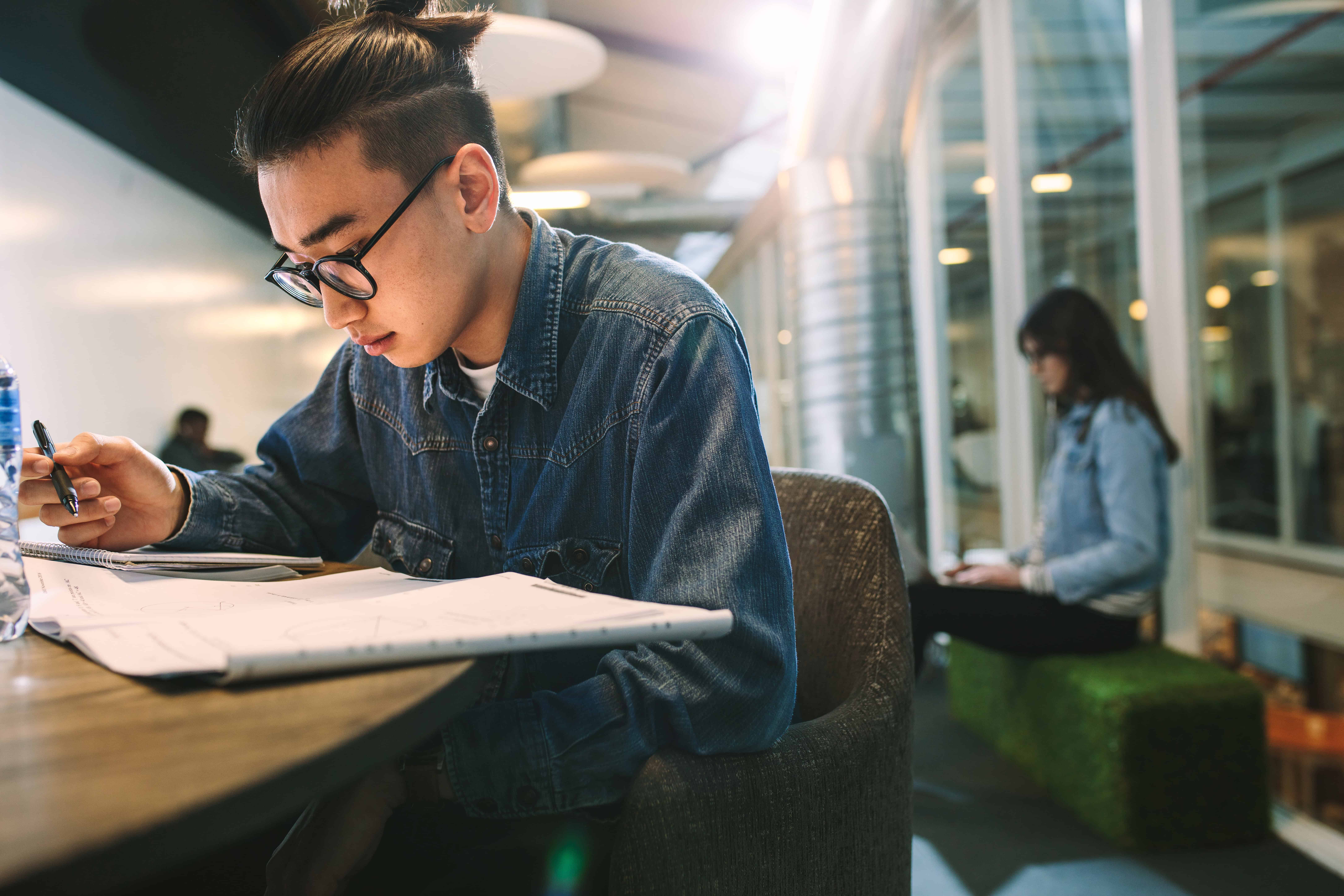 student working at a table